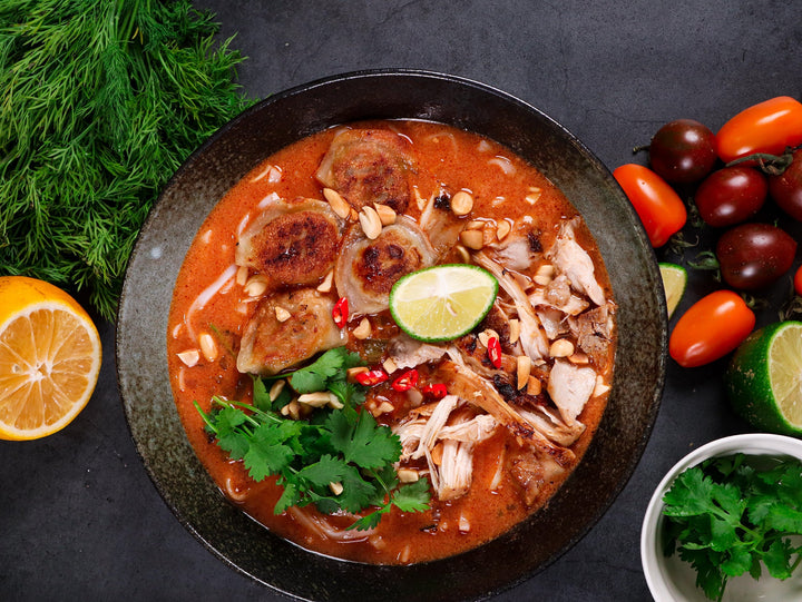 Thai red noodle soup with crispy gyozas